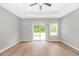 Spacious main bedroom with a tray ceiling, a sliding glass door, and plenty of natural light at 3539 Harrelson Ave., Loris, SC 29569