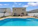Backyard view with a private pool, a fenced yard, and outdoor seating at 4013 Blackwolf Dr., Myrtle Beach, SC 29579