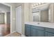 Bathroom with an extended vanity, large mirror, and tile flooring at 4013 Blackwolf Dr., Myrtle Beach, SC 29579