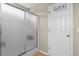 Bathroom with frosted glass shower and a white door with decorative hangers at 4013 Blackwolf Dr., Myrtle Beach, SC 29579