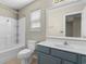 Bathroom with a shower and bath combination and blue vanity at 4013 Blackwolf Dr., Myrtle Beach, SC 29579