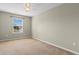Bedroom featuring neutral walls and carpet, illuminated by a window and ceiling fan at 4013 Blackwolf Dr., Myrtle Beach, SC 29579
