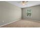Bedroom with neutral walls, carpet, and a window with backyard views at 4013 Blackwolf Dr., Myrtle Beach, SC 29579