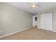 Bedroom with ceiling fan and carpet flooring, a double door closet and a view to the hallway at 4013 Blackwolf Dr., Myrtle Beach, SC 29579