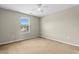 Neutral-toned bedroom featuring a ceiling fan and a window that provides natural light at 4013 Blackwolf Dr., Myrtle Beach, SC 29579