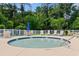 Relax and unwind in the community's inviting hot tub, surrounded by lounge chairs, landscaping and a fenced-in area at 4013 Blackwolf Dr., Myrtle Beach, SC 29579