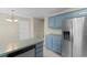 The kitchen features blue cabinets, stainless steel appliances, lots of storage, and a convenient dishwasher at 4013 Blackwolf Dr., Myrtle Beach, SC 29579
