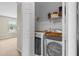Bright laundry closet with modern side-by-side washer and dryer at 4013 Blackwolf Dr., Myrtle Beach, SC 29579