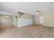 Spacious living room features stylish flooring, modern lighting and stairs with white shiplap detail at 4013 Blackwolf Dr., Myrtle Beach, SC 29579