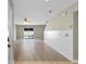 A bright living room features wood flooring, a ceiling fan, sliding doors, and fresh paint ready for personalization at 4013 Blackwolf Dr., Myrtle Beach, SC 29579