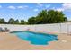 An inviting private pool is surrounded by a spacious patio and white fence, perfect for relaxing and entertaining at 4013 Blackwolf Dr., Myrtle Beach, SC 29579