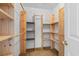 Walk-in closet with custom shelving providing ample storage space for clothing and accessories at 4013 Blackwolf Dr., Myrtle Beach, SC 29579