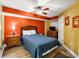 Bedroom featuring a ceiling fan, a wooden dresser and nightstand, and a queen size bed at 4103 N Ocean Blvd. N # 204, North Myrtle Beach, SC 29582