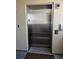 Stainless steel elevator door in a residential building, providing convenient and accessible transportation at 4103 N Ocean Blvd. N # 204, North Myrtle Beach, SC 29582