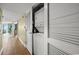 Hallway with a stackable washer and dryer inside of a closet with louvered doors at 4103 N Ocean Blvd. N # 204, North Myrtle Beach, SC 29582
