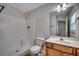 Bright bathroom features a shower and tub combination with a single sink vanity and modern fixtures at 422 South Poplar Dr., Surfside Beach, SC 29575