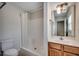 Well-lit bathroom featuring a vanity and shower with curtain at 422 South Poplar Dr., Surfside Beach, SC 29575