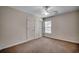 Bedroom with wall-to-wall carpet and a white ceiling fan at 422 South Poplar Dr., Surfside Beach, SC 29575