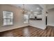 Dining area adjacent to the kitchen featuring wood floors and windows that provide natural light at 422 South Poplar Dr., Surfside Beach, SC 29575