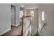 Upstairs hallway with carpeted floor and a staircase to lower level at 422 South Poplar Dr., Surfside Beach, SC 29575