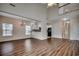 Open concept living space featuring hardwood floors, tall ceilings, and ample natural light at 422 South Poplar Dr., Surfside Beach, SC 29575