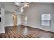 Open living room featuring wood flooring, a vaulted ceiling, and a view of the upper-level landing at 422 South Poplar Dr., Surfside Beach, SC 29575