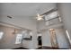 Spacious living room with wood floors, vaulted ceiling, and view of the open kitchen and upper-level landing at 422 South Poplar Dr., Surfside Beach, SC 29575
