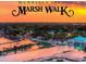 Aerial view of Murrells Inlet Marsh Walk over water at sunset at 4319 Lotus Ct. # A, Murrells Inlet, SC 29576