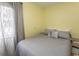 This bedroom features a comfortable bed with a patterned grey comforter and decorative pillows at 4516 Seaview St. # 137, North Myrtle Beach, SC 29582