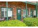 Charming brick building with green accents and inviting outdoor seating area at 4516 Seaview St. # 137, North Myrtle Beach, SC 29582