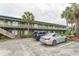 Two-story condo building with brick facade, multiple balconies, and ample parking space at 4516 Seaview St. # 137, North Myrtle Beach, SC 29582