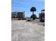 View of the parking lot with distant views of neighboring buildings and palm trees at 4516 Seaview St. # 137, North Myrtle Beach, SC 29582