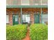 Charming entryway with lush green bushes and two units with doors and windows at 4516 Seaview St. # 137, North Myrtle Beach, SC 29582