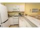 Kitchen featuring neutral cabinets, marble countertops, and adjacent living space at 4516 Seaview St. # 137, North Myrtle Beach, SC 29582