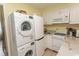 Well-equipped kitchen featuring stainless steel appliances and a stacked washer/dryer unit at 4516 Seaview St. # 137, North Myrtle Beach, SC 29582