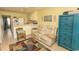 Comfortable living space featuring tile floors, neutral-toned furniture, and kitchen appliances at 4516 Seaview St. # 137, North Myrtle Beach, SC 29582