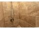 Shower stall featuring neutral toned tiles and convenient, adjustable shower head at 4516 Seaview St. # 137, North Myrtle Beach, SC 29582