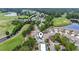 An aerial view of the community featuring golf course, pond, mature trees and community pool and tennis at 4574 Girvan Dr. # D, Myrtle Beach, SC 29579