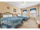 Charming bedroom with two beds featuring patterned blue bedding, soft natural light, and ample space at 4574 Girvan Dr. # D, Myrtle Beach, SC 29579