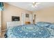 Bedroom featuring two beds, ceiling fan, dresser, and access to other rooms at 4574 Girvan Dr. # D, Myrtle Beach, SC 29579