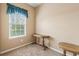 Bedroom featuring a window with blinds and two wooden tables at 4574 Girvan Dr. # D, Myrtle Beach, SC 29579