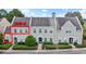 Exterior view of a two-story townhouse featuring well-maintained landscaping, and a private entrance to Unit D at 4574 Girvan Dr. # D, Myrtle Beach, SC 29579