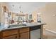 Functional kitchen with modern appliances, an open layout, and a view of the living area and bedroom at 4574 Girvan Dr. # D, Myrtle Beach, SC 29579