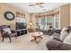 Cozy living room with plush sofas, a TV, and a bay window providing ample natural light, perfect for relaxation at 4574 Girvan Dr. # D, Myrtle Beach, SC 29579