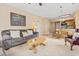 Comfortable living room featuring a plush sofa, a view of dining area, and a partial view of kitchen at 4574 Girvan Dr. # D, Myrtle Beach, SC 29579