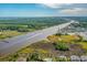 Scenic aerial shot of a waterfront community, river, and ocean coastline in the distance at 4648 Greenbriar Dr. # D2, Little River, SC 29566
