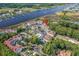 Aerial view of a waterfront condo community featuring a pool, lush landscaping, and waterway access at 4648 Greenbriar Dr. # D2, Little River, SC 29566