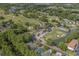 Picturesque aerial view of a golf course community with ponds, mature trees and lush green fairways at 4648 Greenbriar Dr. # D2, Little River, SC 29566