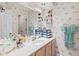 Bathroom featuring decorated walls, a large mirror, and ample storage space and shelves at 4648 Greenbriar Dr. # D2, Little River, SC 29566
