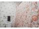 Cozy bathroom featuring beach themed wallpaper, shower curtain, and towel rack with towel at 4648 Greenbriar Dr. # D2, Little River, SC 29566